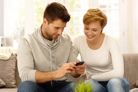 Young couple using mobile