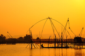 Traditional fishing tools and fishing boat in swamp