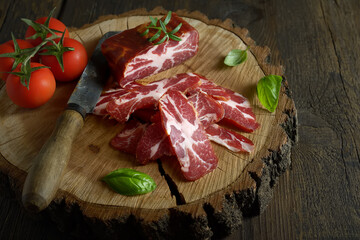 beef jerky and spice on old table, vegetables