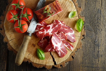beef jerky and spice on old table, vegetables