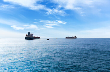 Rendezvous of two ships on the high seas. Commercial container ship on the high seas