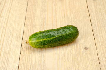 Cucumber on a white wooden background