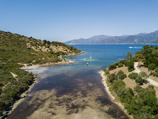 Aerial view of bay with yacht