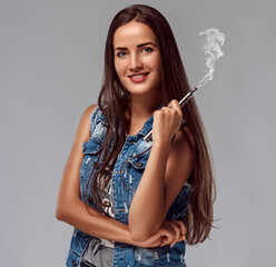 Young woman is smoking e-cigarette. Vape.