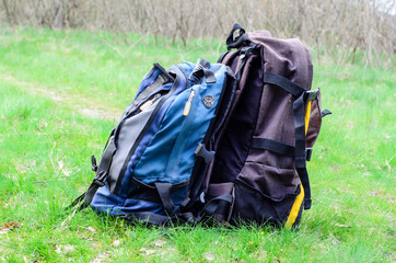 Backpacks on the green grass