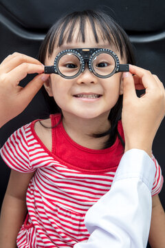 Asian Little Chinese Girl Doing Eyes Examination