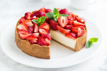 delicious strawberry cheesecake on white background