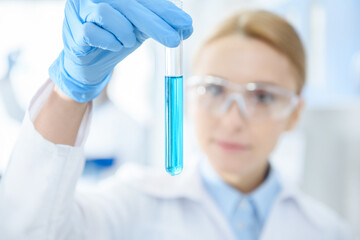 Close-up view of professional scientist holding test tube with reagent in lab © LIGHTFIELD STUDIOS