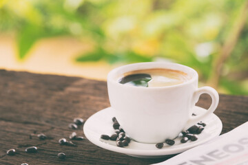 A cup of coffee and a newspaper