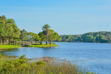 A beautiful day for a walk and the view of the wood bridge to the island at John S. Taylor Park in Largo, Florida.