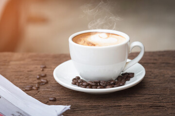 A cup of coffee and a newspaper