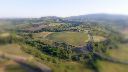 Fototapeta na wymiar Tuscany countryside hills, stunning aerial view in spring