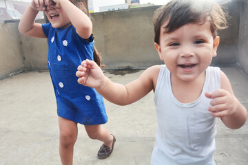 Happy siblings playing