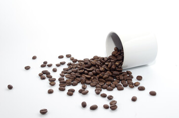 coffee beans and white coffee cup on white background