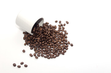 coffee beans and white coffee cup on white background