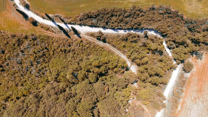 Aerial panoramic view of Tuscany winding road, Italy