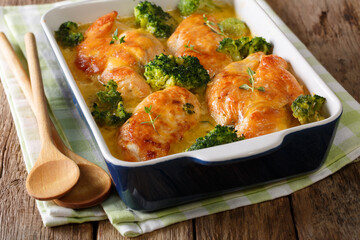 Chicken fillet and broccoli baked in cheese sauce in a baking dish. horizontal