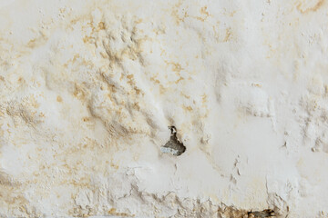 paint color swelling on old white wall