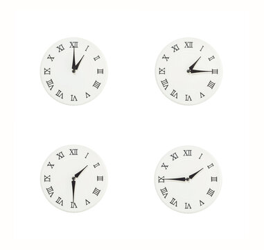 Closeup group of white clock with shadow for decorate show the time in 1 , 1:15 , 1:30 , 1:45 p.m. isolated on white background , beautiful 4 wall clock picture in different time