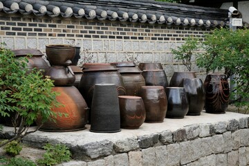 Obraz premium Platform for crocks of sauces and condiments in old traditional house 
