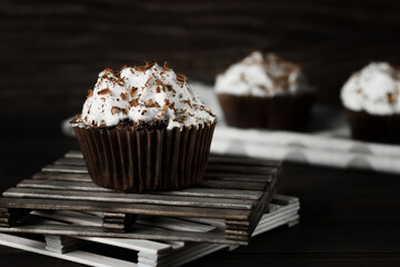 Chocolate-coffee cupcakes on a dark wooden background