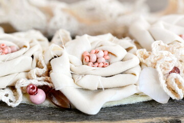 Floral necklace from fabric, lace trims, beads and felt base. Summer beautiful textile accessory for women and girls. Nice pastel necklace from recycled materials idea. Closeup