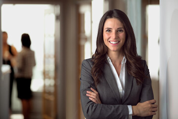 Happy smiling ceo manager at office space, possibly real estate, lawyer, non-profit, marketing