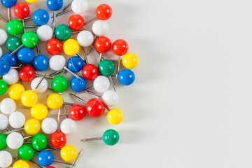 colorful color push pins isolated on white background