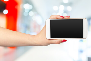 Mock up smartphone with blank screen in woman hands