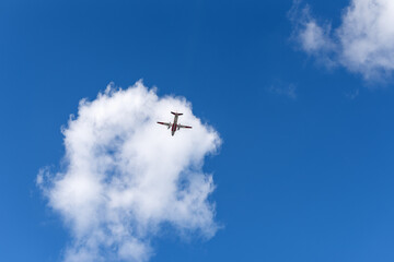 Fototapeta na wymiar Airplane in the sky and beautiful cloud. Business summer vacation and travel adventure concept