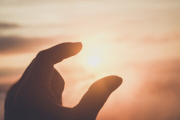 Naklejka na ściany i meble silhouette hand with sunlight