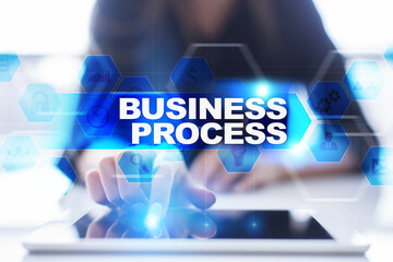Woman using tablet pc, pressing on virtual screen and selecting business process.