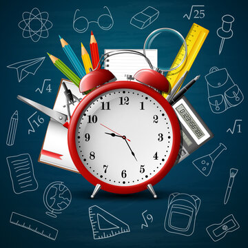 Back to school background with red alarm clock and school supplies
