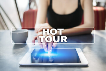 Woman using tablet pc and selecting hot tour.