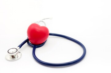 red heart and a stethoscope on white background, health care medical technology concept, soft focus, selective focus.