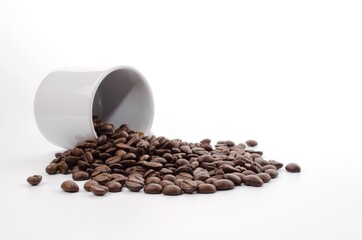 coffee beans and white coffee cup on white background
