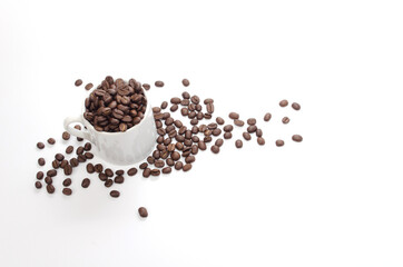 coffee beans and white coffee cup on white background