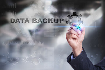 Businessman is drawing on virtual screen. data backup concept.