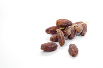 dried date palm fruit isolate on white background, ramadan kareem food