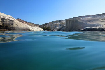 Fototapeta na wymiar Photo of volcanic island of Milos with clear waters and caves, Cyclades, Greece