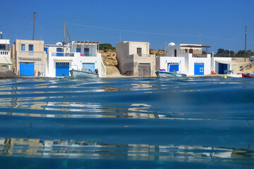 Photo of volcanic island of Milos with clear waters and caves, Cyclades, Greece