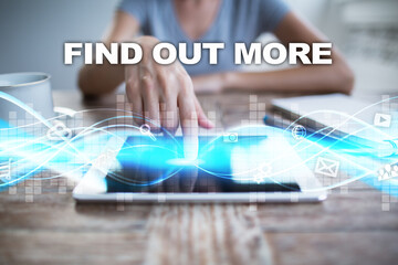 Woman using tablet pc, pressing on virtual screen and selecting find out more.