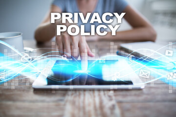 Woman using tablet pc, pressing on virtual screen and selecting privacy policy.