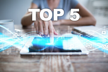 Woman using tablet pc, pressing on virtual screen and selecting top 5.