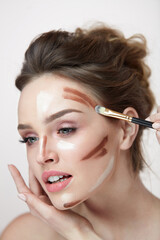 Woman Face Makeup. Closeup Of Female With Contouring Lines