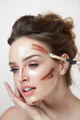 Obraz premium Woman Face Makeup. Closeup Of Female With Contouring Lines