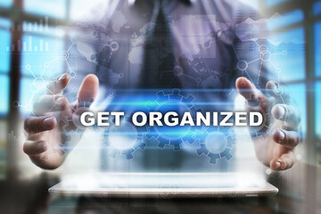 Fototapeta na wymiar Businessman using tablet pc and selecting get organized.