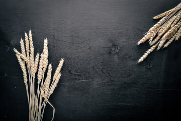 Rye, wheat Wooden on black background. Top view.