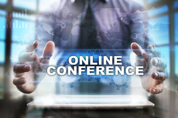 Businessman using tablet pc and selecting online conference.