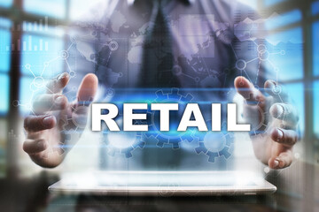Fototapeta na wymiar Businessman using tablet pc and selecting retail.